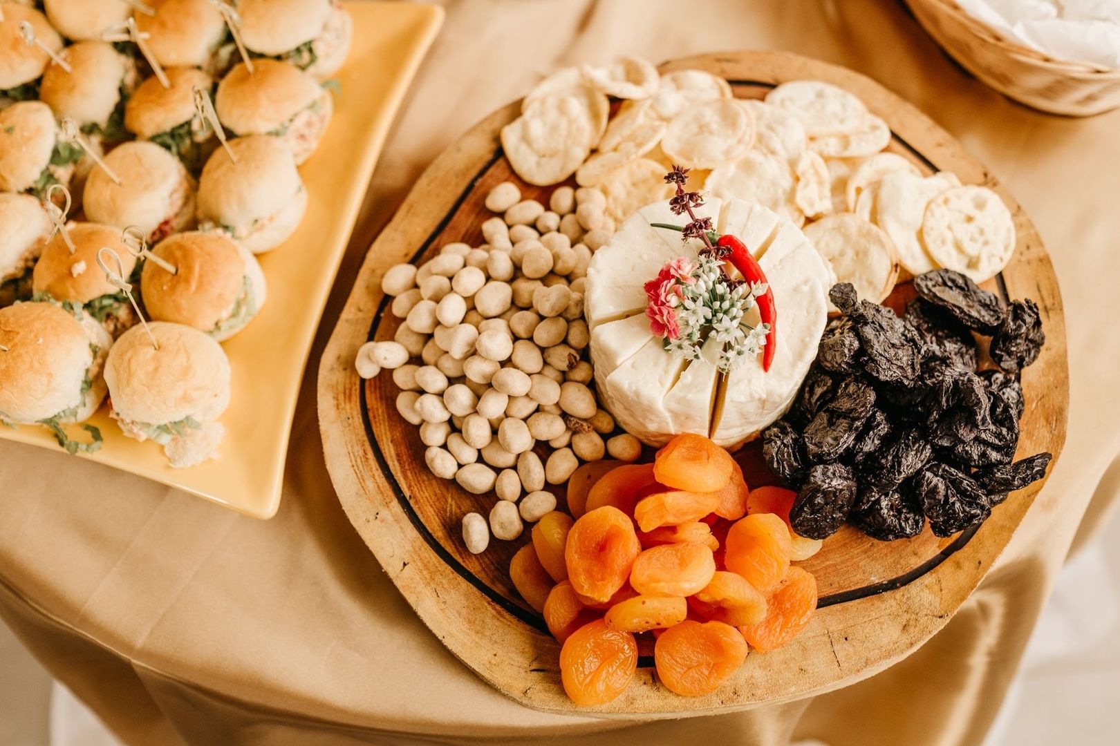 Classic relish tray with cheese, dried fruit, nuts, and mini sandwiches